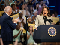 President Joe Biden and the audience cheer Vice President Kamala Harris during an event announcing reductions in Medicare prices for ten wid...