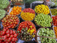 Customers are shopping at a fruit market next to Manzhouli Zhongsu Pedestrian Street in Hohhot, Inner Mongolia, China, on August 15, 2024. (