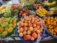 Customers are shopping at a fruit market next to Manzhouli Zhongsu Pedestrian Street in Hohhot, Inner Mongolia, China, on August 15, 2024. (