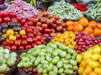 Customers are shopping at a fruit market next to Manzhouli Zhongsu Pedestrian Street in Hohhot, Inner Mongolia, China, on August 15, 2024. (