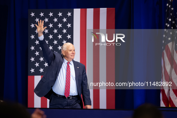 Sen. Ben Cardin (D-MD) waves as he walks on stage at an event announcing reduced Medicare prices for ten widely-used drugs, Upper Marlboro,...