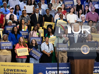 Audience members listen as President Joe Biden delivers remarks at an event announcing reductions in Medicare prices for ten widely-used dru...