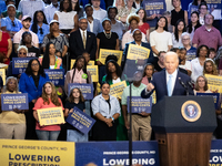 Audience members listen as President Joe Biden delivers remarks at an event announcing reductions in Medicare prices for ten widely-used dru...