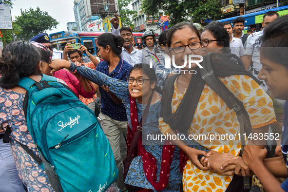 Clashes are being seen between students and police during a protest demonstration against the rape and murder of a second-year doctor at RG...