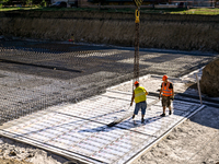 Builders are working at an underground school construction site in the Shyroke community, Zaporizhzhia region, southeastern Ukraine, on Augu...