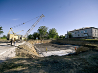 Builders are working at an underground school construction site in the Shyroke community, Zaporizhzhia region, southeastern Ukraine, on Augu...