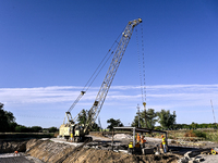 Builders are working at an underground school construction site in the Shyroke community, Zaporizhzhia region, southeastern Ukraine, on Augu...