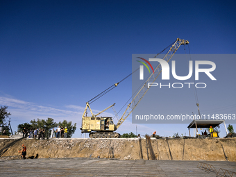 Builders are working at an underground school construction site in the Shyroke community, Zaporizhzhia region, southeastern Ukraine, on Augu...