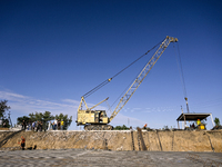 Builders are working at an underground school construction site in the Shyroke community, Zaporizhzhia region, southeastern Ukraine, on Augu...