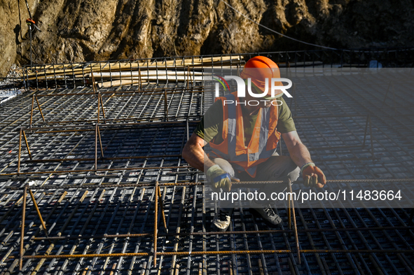 A builder is working at an underground school construction site in the Shyroke community, Zaporizhzhia region, southeastern Ukraine, on Augu...