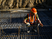 A builder is working at an underground school construction site in the Shyroke community, Zaporizhzhia region, southeastern Ukraine, on Augu...