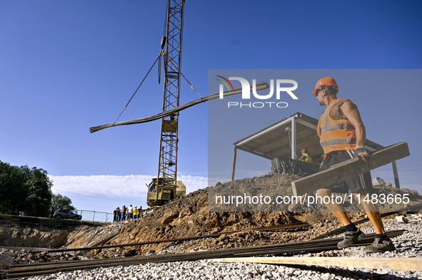 A builder is working at an underground school construction site in the Shyroke community, Zaporizhzhia region, southeastern Ukraine, on Augu...