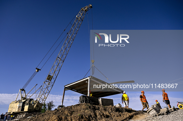 Builders are working at an underground school construction site in the Shyroke community, Zaporizhzhia region, southeastern Ukraine, on Augu...