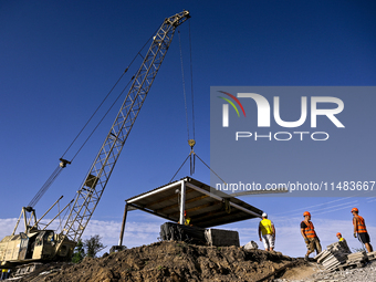 Builders are working at an underground school construction site in the Shyroke community, Zaporizhzhia region, southeastern Ukraine, on Augu...