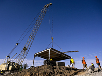 Builders are working at an underground school construction site in the Shyroke community, Zaporizhzhia region, southeastern Ukraine, on Augu...