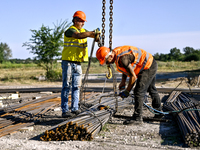 Builders are working at an underground school construction site in the Shyroke community, Zaporizhzhia region, southeastern Ukraine, on Augu...