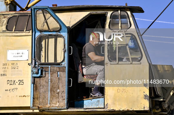 A builder is working at an underground school construction site in the Shyroke community, Zaporizhzhia region, southeastern Ukraine, on Augu...