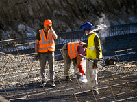 Builders are working at an underground school construction site in the Shyroke community, Zaporizhzhia region, southeastern Ukraine, on Augu...