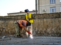 Builders are working at an underground school construction site in the Shyroke community, Zaporizhzhia region, southeastern Ukraine, on Augu...