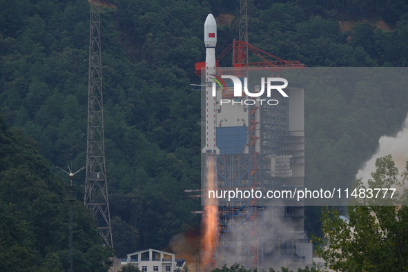 A Long March-4B carrier rocket is lifting off a remote sensing 4301 satellite from the Xichang Satellite Launch Center in Sichuan, China, on...