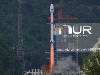 A Long March-4B carrier rocket is lifting off a remote sensing 4301 satellite from the Xichang Satellite Launch Center in Sichuan, China, on...