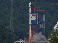 A Long March-4B carrier rocket is lifting off a remote sensing 4301 satellite from the Xichang Satellite Launch Center in Sichuan, China, on...