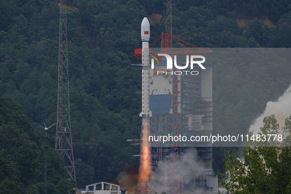 A Long March-4B carrier rocket is lifting off a remote sensing 4301 satellite from the Xichang Satellite Launch Center in Sichuan, China, on...