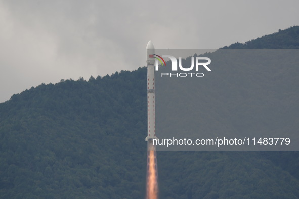 A Long March-4B carrier rocket is lifting off a remote sensing 4301 satellite from the Xichang Satellite Launch Center in Sichuan, China, on...