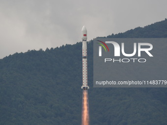 A Long March-4B carrier rocket is lifting off a remote sensing 4301 satellite from the Xichang Satellite Launch Center in Sichuan, China, on...