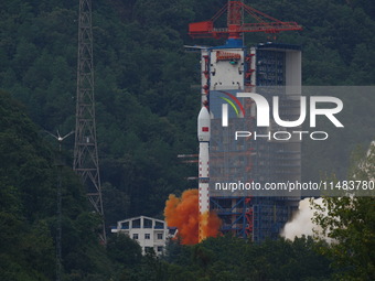 A Long March-4B carrier rocket is lifting off a remote sensing 4301 satellite from the Xichang Satellite Launch Center in Sichuan, China, on...