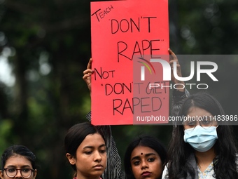 Women are protesting against rape in Dhaka, Bangladesh, on August 16, 2024, following the rape and murder of a doctor in India. (