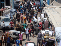 Palestinians are fleeing with their belongings in Deir el-Balah, in the central Gaza Strip, on August 16, 2024, amid the ongoing conflict be...