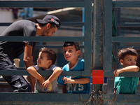 Palestinians are fleeing with their belongings in Deir el-Balah, in the central Gaza Strip, on August 16, 2024, amid the ongoing conflict be...