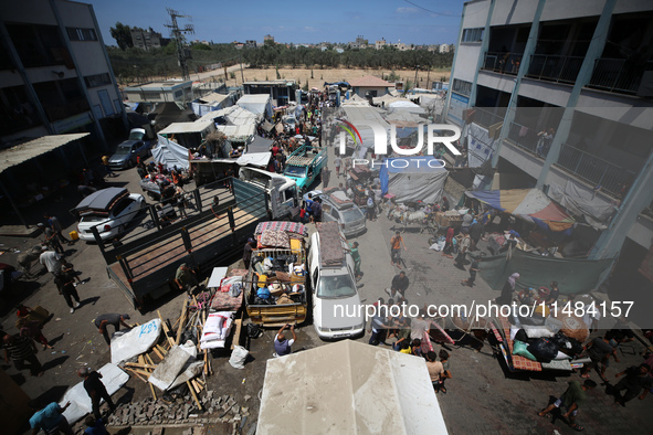 Palestinians are fleeing with their belongings in Deir el-Balah, in the central Gaza Strip, on August 16, 2024, amid the ongoing conflict be...