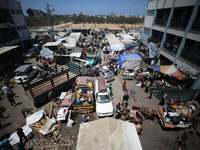 Palestinians are fleeing with their belongings in Deir el-Balah, in the central Gaza Strip, on August 16, 2024, amid the ongoing conflict be...