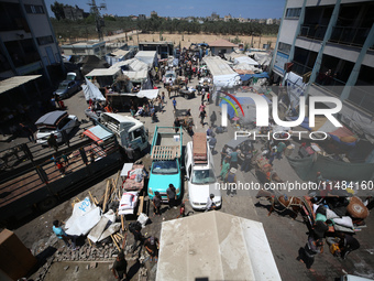 Palestinians are fleeing with their belongings in Deir el-Balah, in the central Gaza Strip, on August 16, 2024, amid the ongoing conflict be...