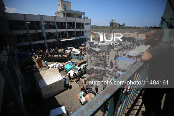 Palestinians are fleeing with their belongings in Deir el-Balah, in the central Gaza Strip, on August 16, 2024, amid the ongoing conflict be...