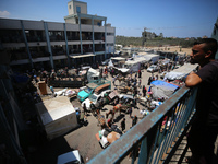 Palestinians are fleeing with their belongings in Deir el-Balah, in the central Gaza Strip, on August 16, 2024, amid the ongoing conflict be...