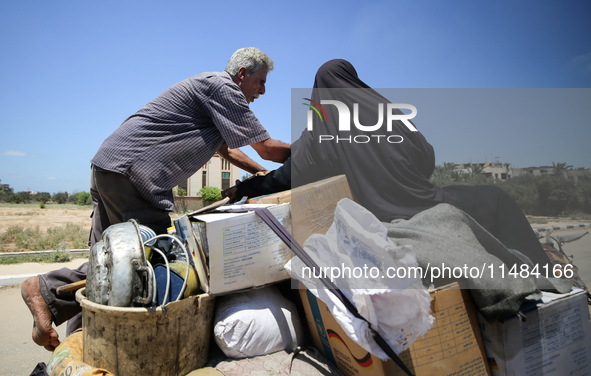 Palestinians are fleeing with their belongings in Deir el-Balah, in the central Gaza Strip, on August 16, 2024, amid the ongoing conflict be...