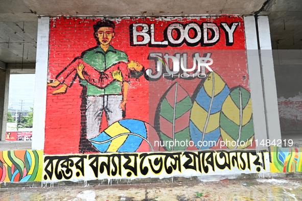 Students are painting graffiti on a wall alongside a road to express their message after the fall of Bangladesh's former Prime Minister Shei...