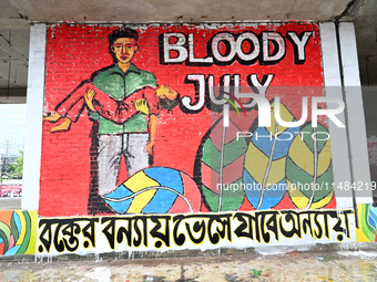 Students are painting graffiti on a wall alongside a road to express their message after the fall of Bangladesh's former Prime Minister Shei...