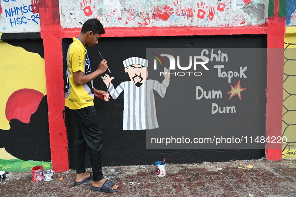 Students are painting graffiti on a wall alongside a road to express their message after the fall of Bangladesh's former Prime Minister Shei...