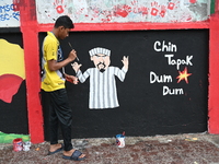 Students are painting graffiti on a wall alongside a road to express their message after the fall of Bangladesh's former Prime Minister Shei...