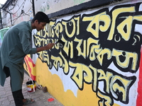 Students are painting graffiti on a wall alongside a road to express their message after the fall of Bangladesh's former Prime Minister Shei...