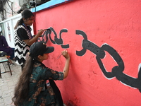 Students are painting graffiti on a wall alongside a road to express their message after the fall of Bangladesh's former Prime Minister Shei...