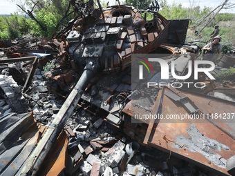 A Ukrainian tank destroyed by a Russian ZALA Lancet loitering munition during fighting in the Bakhmut direction in 2023 is at the positions...