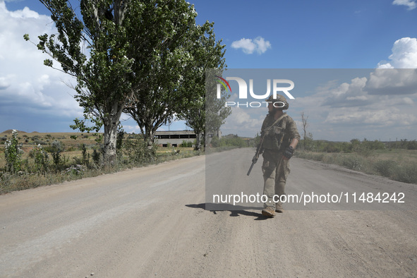 A serviceman of the Motorised Rifle Battalion of the 93rd Kholodnyi Yar Separate Mechanized Brigade of the Ukrainian Armed Forces is walking...