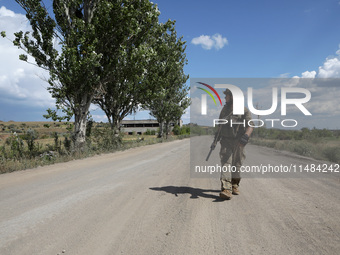 A serviceman of the Motorised Rifle Battalion of the 93rd Kholodnyi Yar Separate Mechanized Brigade of the Ukrainian Armed Forces is walking...