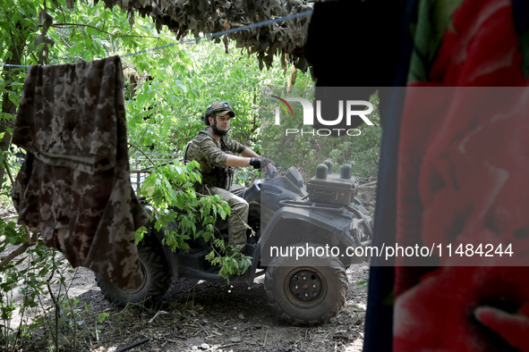 A serviceman of the Motorised Rifle Battalion of the 93rd Kholodnyi Yar Separate Mechanized Brigade of the Ukrainian Armed Forces is sitting...