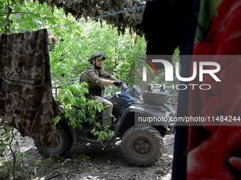 A serviceman of the Motorised Rifle Battalion of the 93rd Kholodnyi Yar Separate Mechanized Brigade of the Ukrainian Armed Forces is sitting...